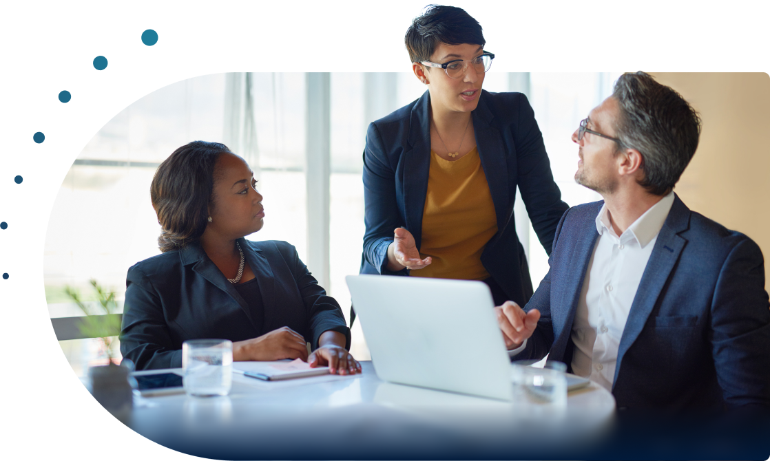 Three individuals discussing strategic guidance in healthcare